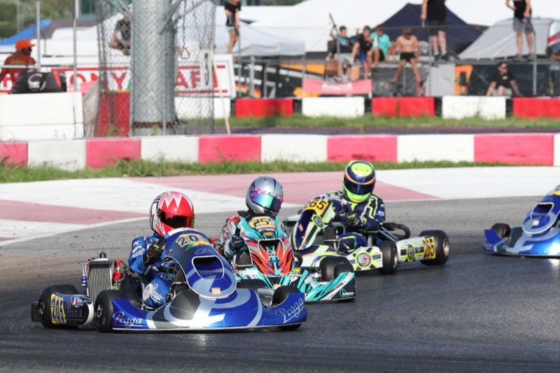 Khalid's number 205 Praga kart leading three rivals through a corner in Italy